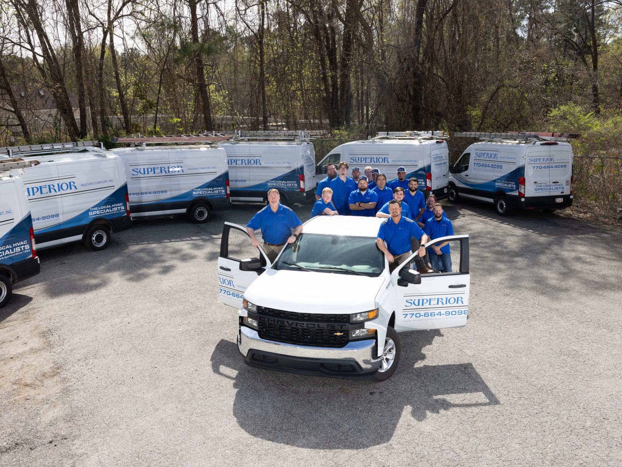 Superior Indoor Comfort, Inc. HVAC team with fleet trucks